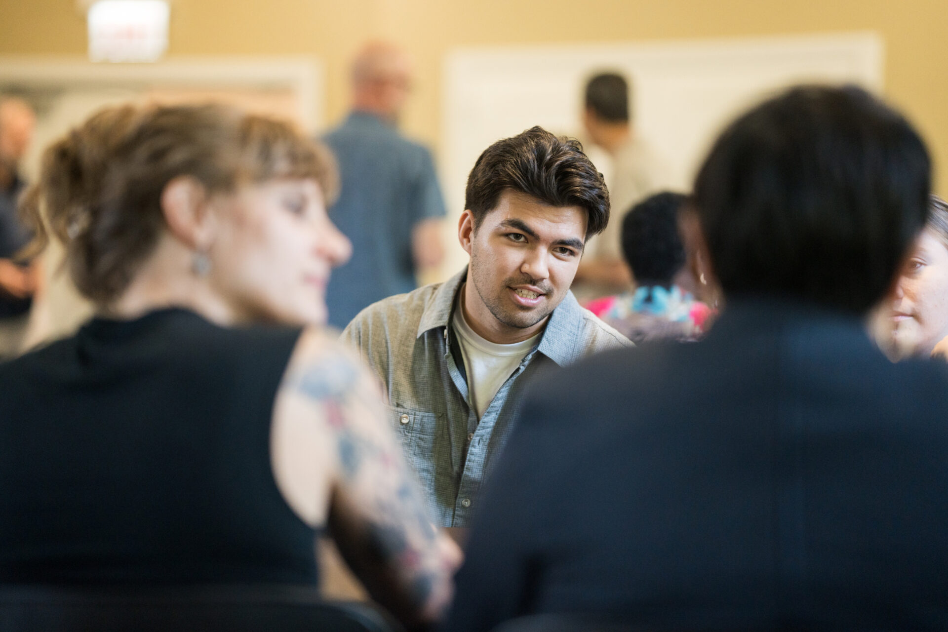 Male student talks with others