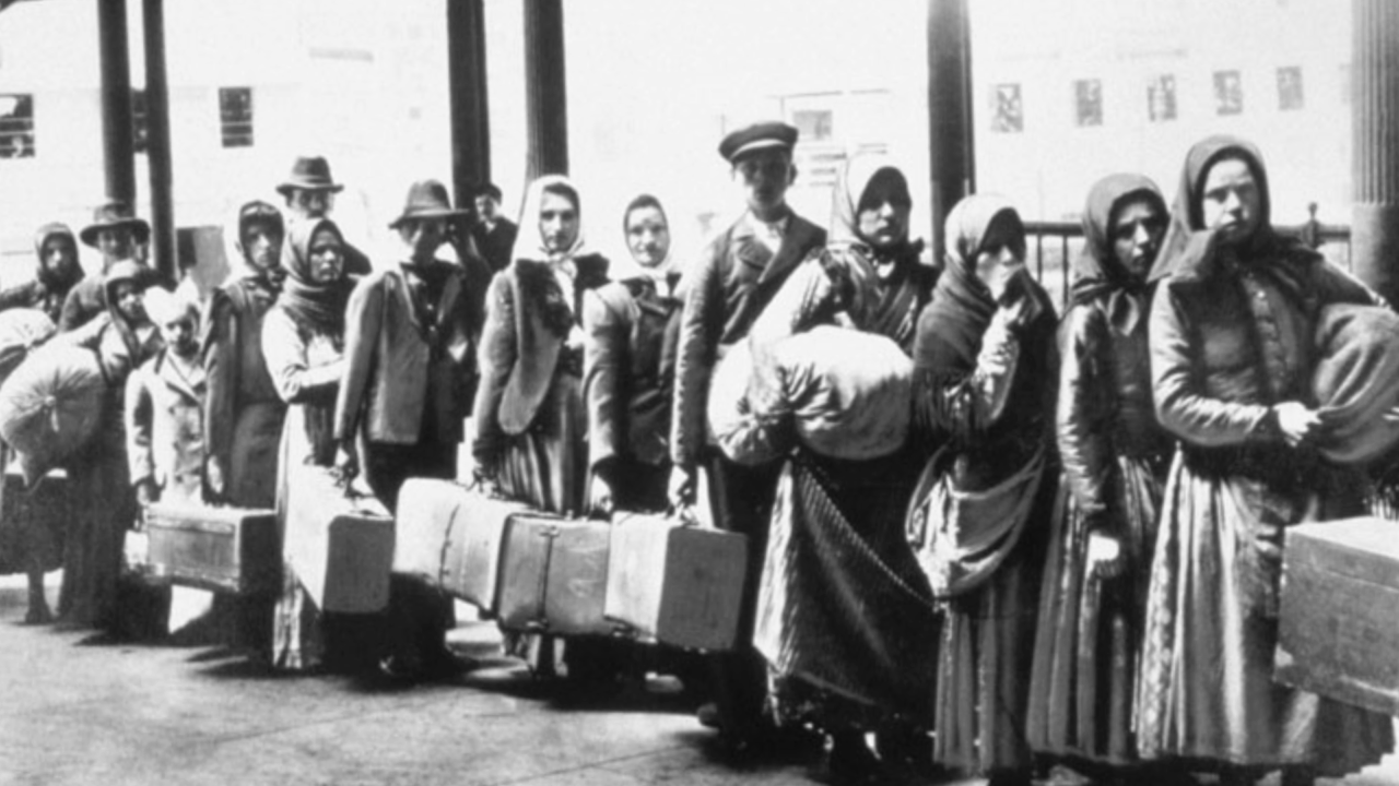 Black and white historical image of swedish immigrants standing in line