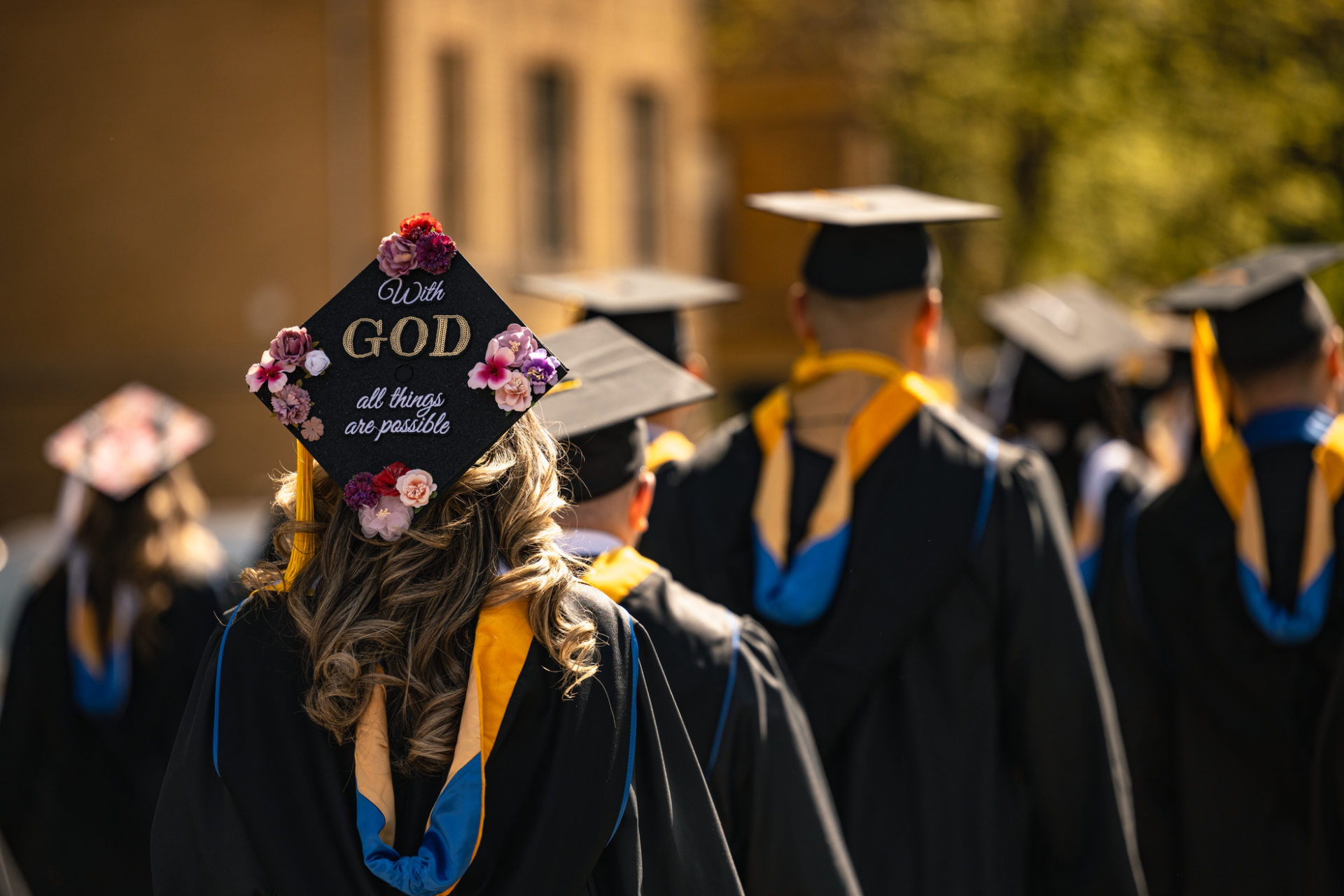 Graduate wears hat 