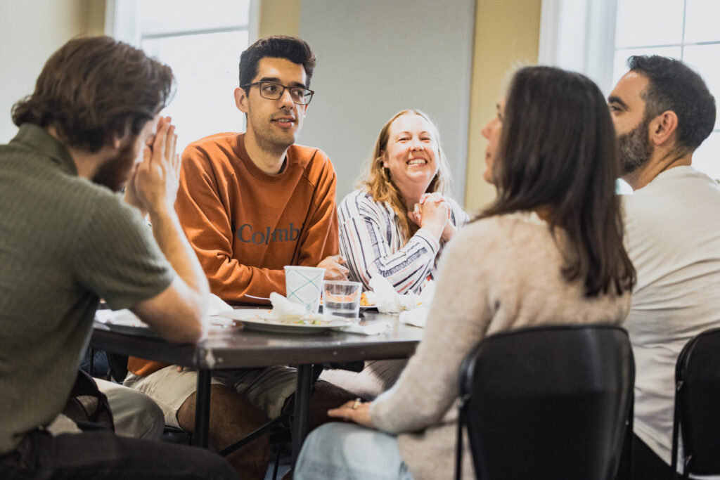 students laugh over a meal