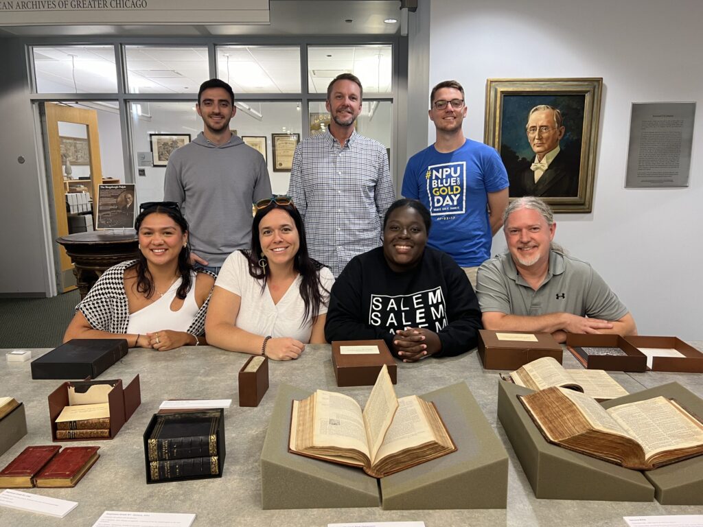students pose with archival literature