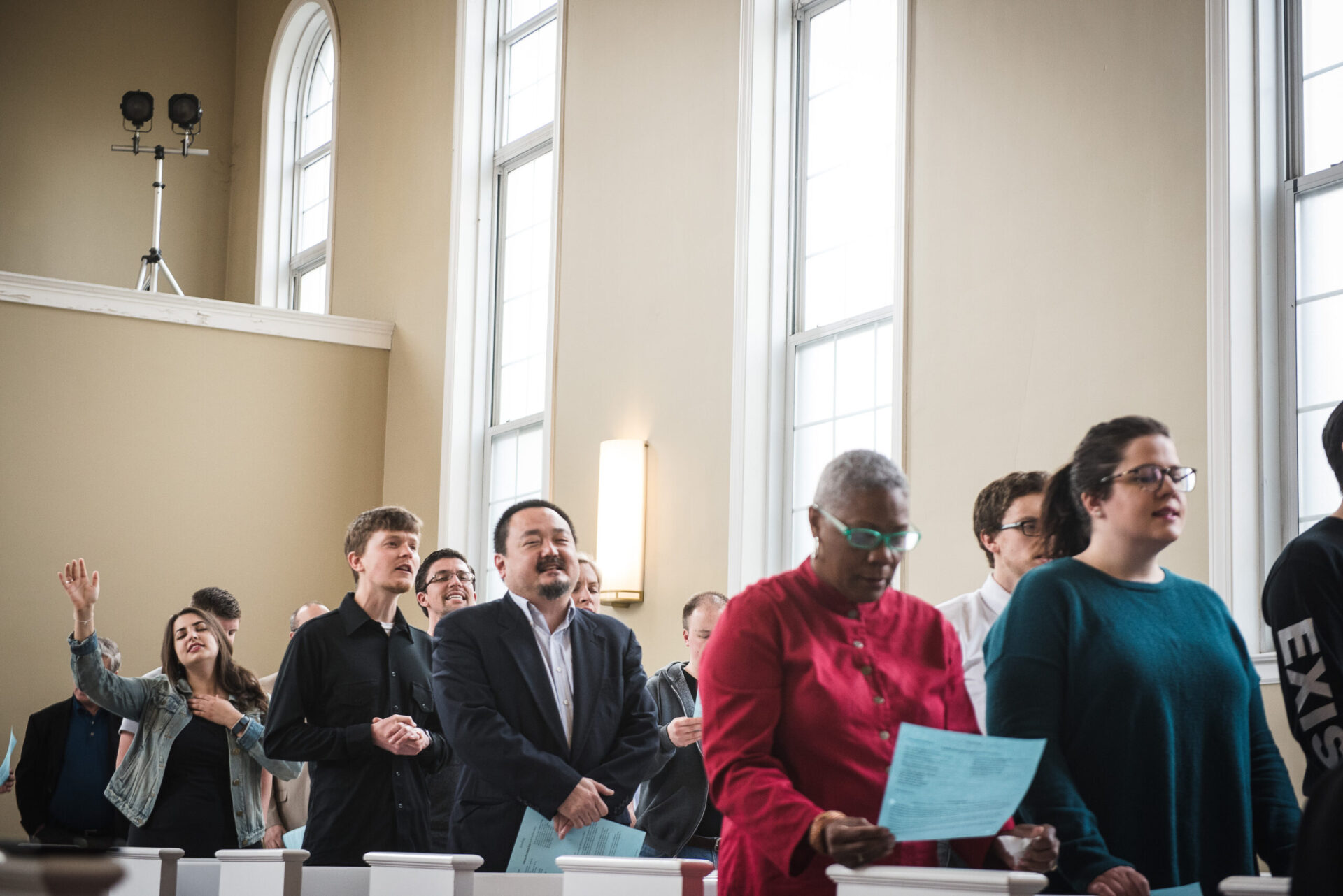 community standing in worship