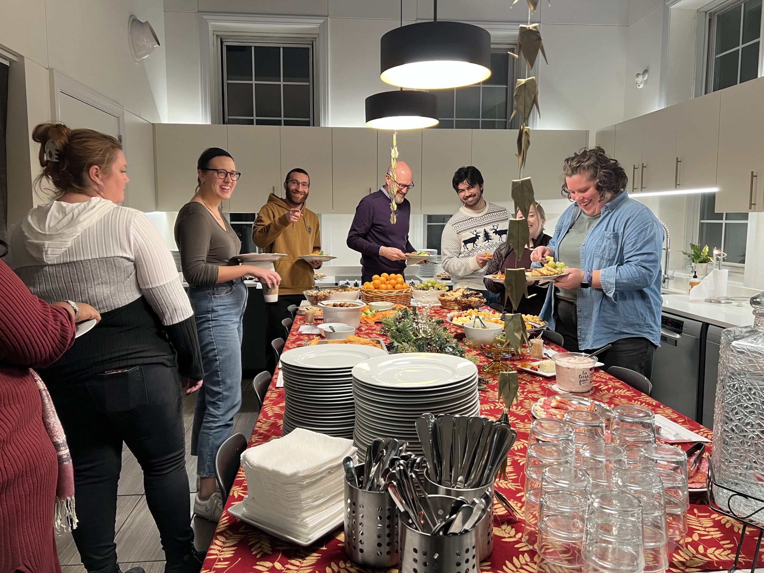 students get food in kitchen at holiday meal