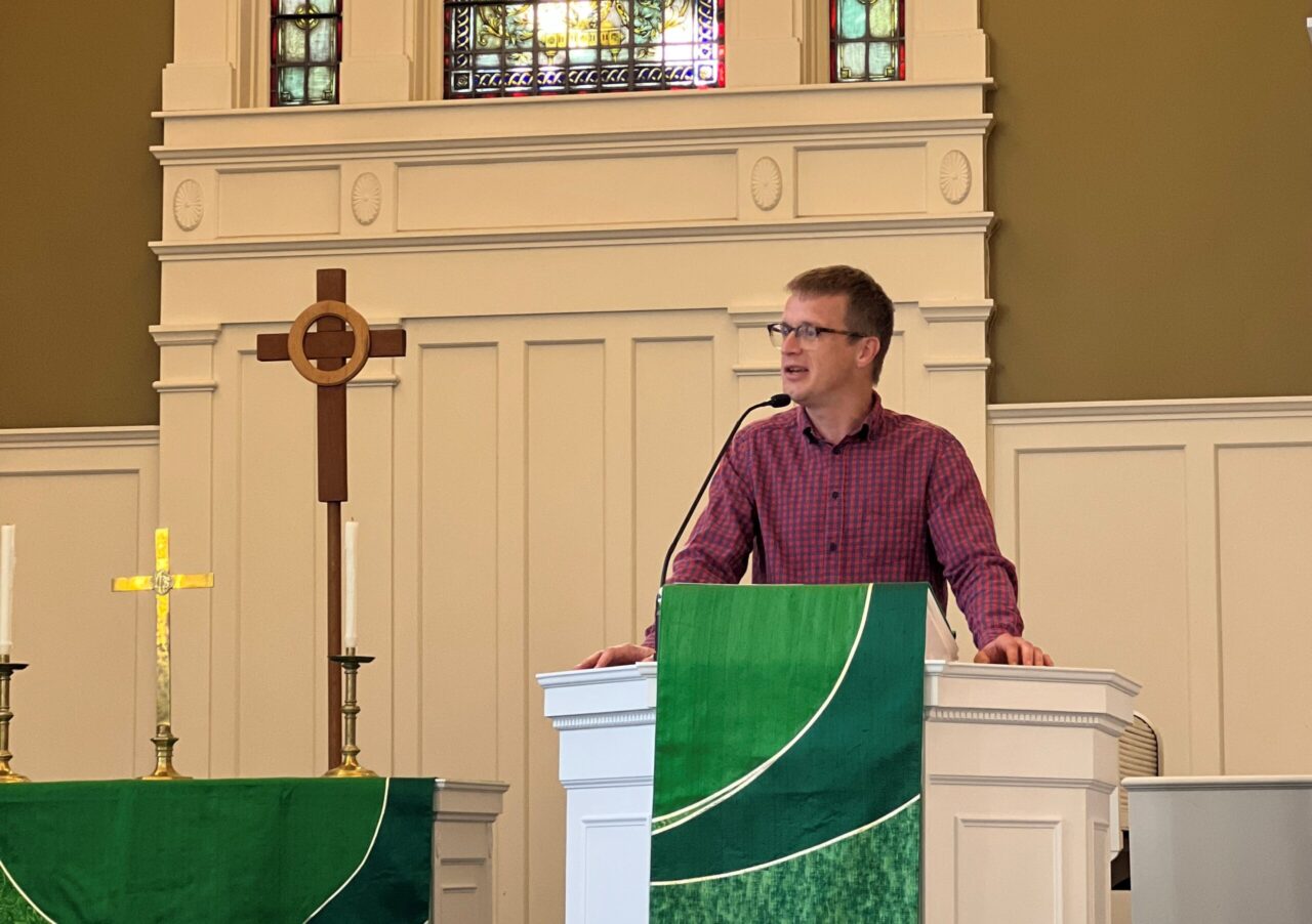 person preaching in Isaacson Chapel
