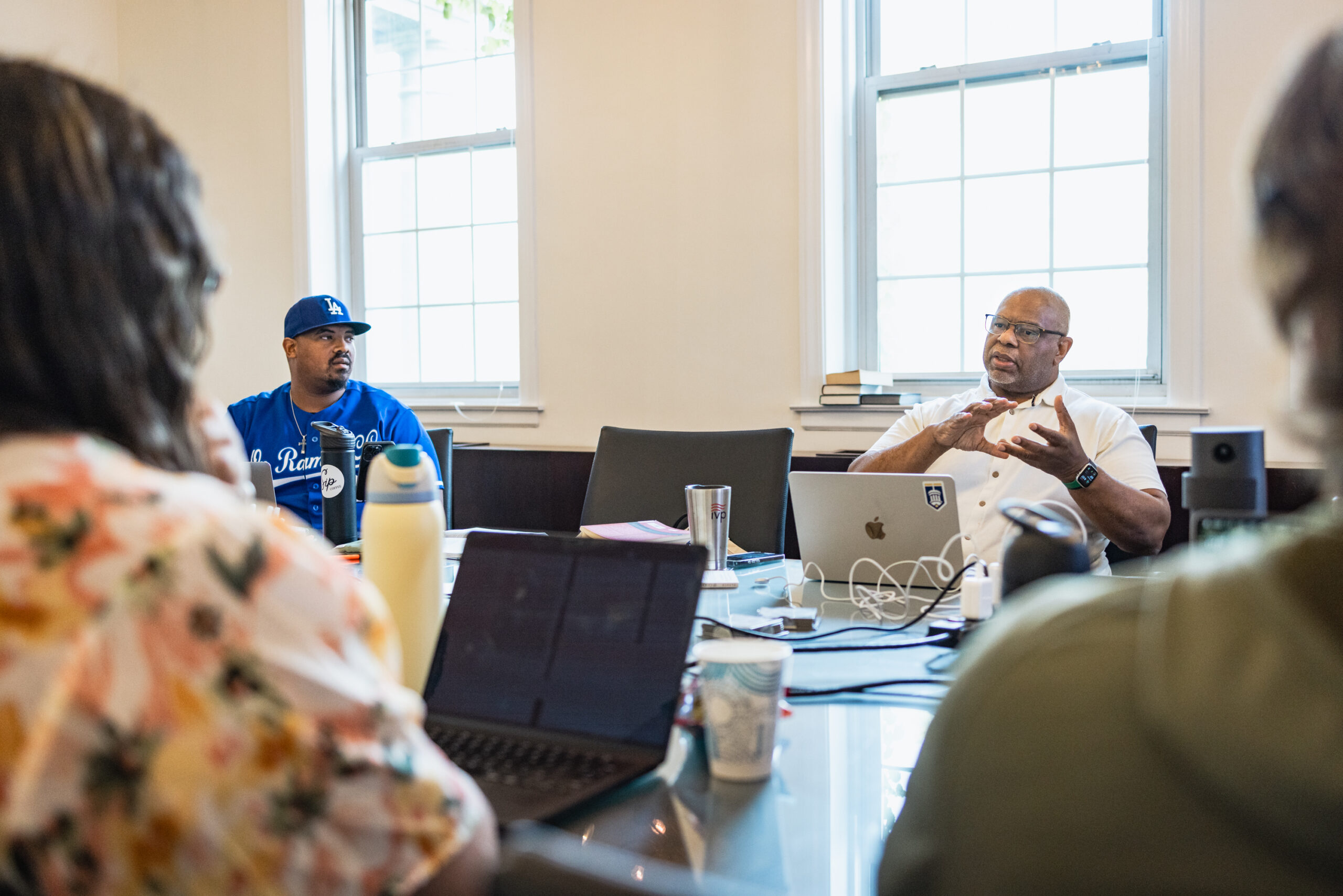 Dr Dennis Edwards, teaches in seminary conference room while students look on