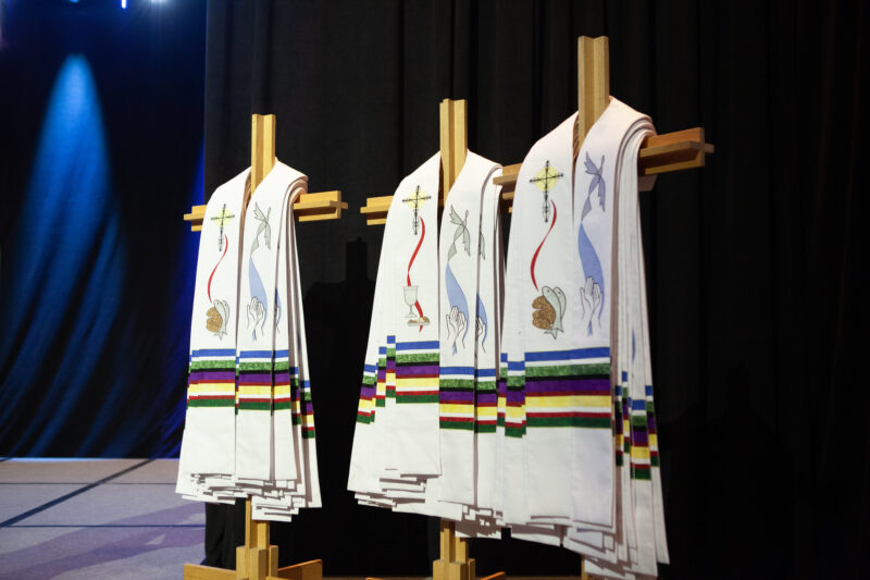 Stoles hanging in preparation for ordination service